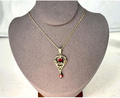 A modern 9 carat hallmarked gold Art Nouveau style pendant on 9 carat hallmarked gold chain, 3.5 grams; a Swarovski crystal s