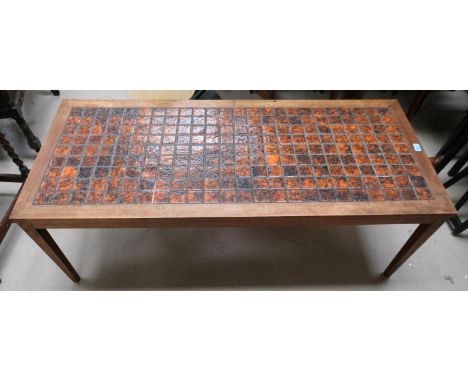 A mid 20th Century large teak tile top Danish designer coffee table with rust-coloured squares, 137x158cm.