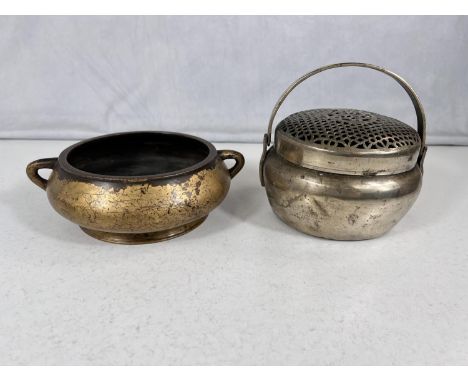 A Chinese bronze censor with double handles wear to the gilt with impressed mark to the base, diameter 15cm and another Chine
