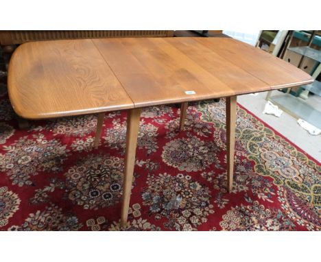 A 1960's rectangular Ercol elm drop-leaf dining table, model 383