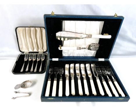 A Silver scallop shaped caddy spoon, Sheffield 1973, five silver cake forks, a pair of tongs&nbsp; 3.5oz total,&nbsp; EPNS tr