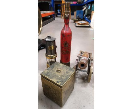 A Gateshead-on-Tyne miners lamp, a George VI extinguisher in red livery, a brass cannon and a brass tea caddy