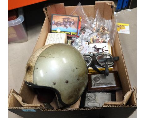A vintage motorbike helmet, goggles etc and miniature toy soldiers, games etc.