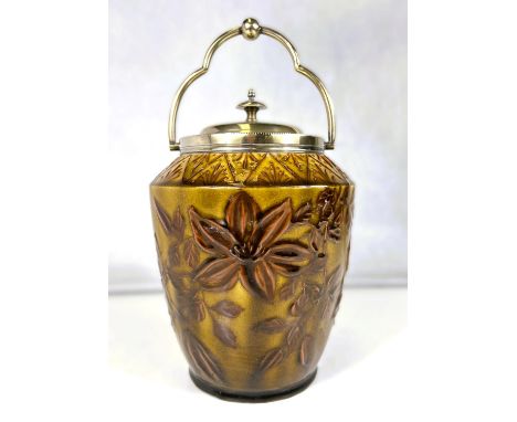 Linthorpe Art Pottery: A biscuit barrel of tapering form with silver plated handle, rim and lid decorated in relief with flow