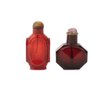 TWO RUBY GLASS SNUFF BOTTLES18th/19th centuryThe first transparent ruby-red glass bottle of octagonal shape, carved on either