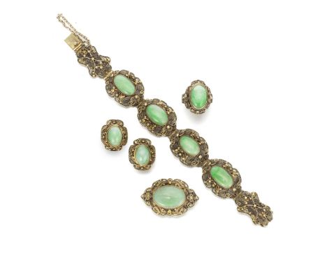 A JADEITE-INSET GILT-FILIGREE BRACELET, EARINGS, RING AND BROOCH SUITEEarly 20th centuryThe oval-shaped jadeite stones mounte