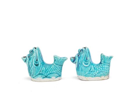 A PAIR OF TURQUOISE GLAZED 'LEAPING FISH-DRAGON' WATER DROPPERSKangxiEach modelled with a dragon-head and fish body and tail,