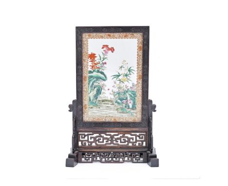 A FAMILLE ROSE 'FLORAL' TABLE SCREEN19th centuryFinely enamelled on one side with a variety of flowering plants, all issuing 