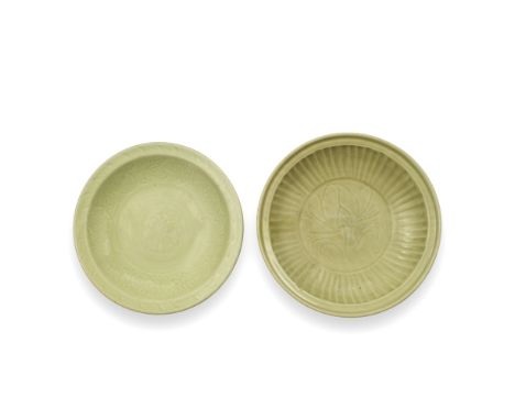 TWO LONGQUAN CELADON GLAZED DISHESMing Dynasty, 15th centuryThe first carved with a large central lotus spray within a radiat