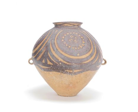 A LARGE NEOLITHIC POTTERY JARProbably Majiayao Yangshao Culture Gansu 2300 - 2000 B.C.Of brown and tan earthenware, the upper