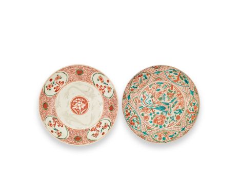 TWO SWATOW POLYCHROME DISHES16th/17th centuryComprising: one dish with a central lotus flower medallion and four chrysanthemu