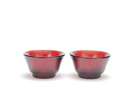 A PAIR OF RUBY RED GLASS BOWLSIncised Qianlong four-character marks and probably of the periodEach vessel resting on a short 