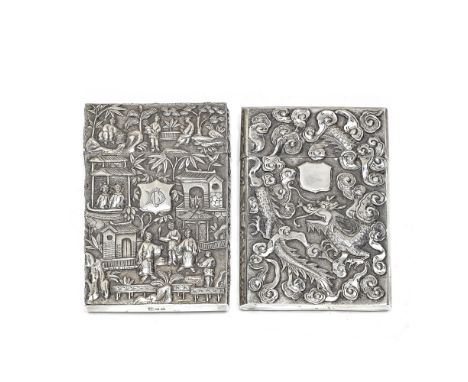 TWO SILVER CARD CASESSecond half of the 19th centuryComprising: a silver card case with relief decoration of figures playing 