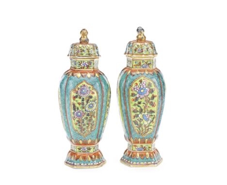 A PAIR OF CLOBBERED VASES AND COVERSKangxiEach of baluster shape, the lobed body painted with flower sprays enclosed in green
