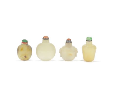 A GROUP OF FOUR AGATE SNUFF BOTTLES19th centuryComprising: a compressed spherical bottle; another of rounded form with carved