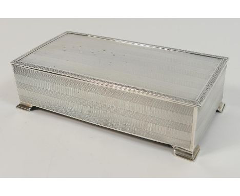 George V silver cigarette box, London 1929, engine turned rectangular form engraved to the inside cover with a crest and the 