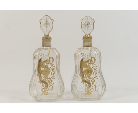 Pair of naval commissioned gilt engraved glass decanters, late 19th Century, each with star cut stopper over a body engraved 