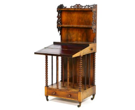 Unusual William IV rosewood canterbury writing table, having a back with two shelves with fretwork sides, pull open slope wit