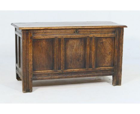Oak joined coffer, early 18th Century, three plank top with later hinges, over three recessed panel front with channel moulde
