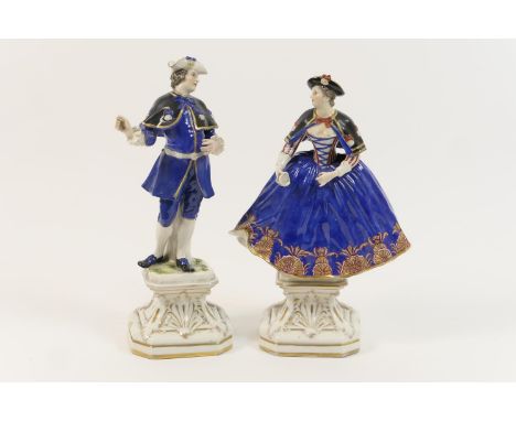Pair of French porcelain figures, modelled as a gallant and his companion, glazed in colours over a gilded canted square base