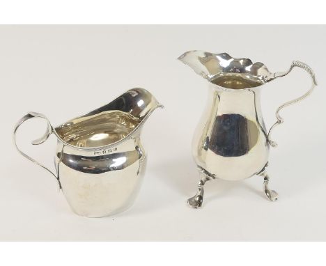 Silver baluster cream jug, Sheffield 1900, 10cm; also a silver helmet shaped cream jug, Birmingham 1919, 8.5cm, gross weight 