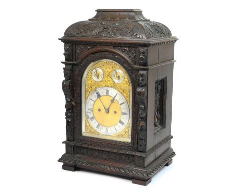 Victorian carved oak bracket clock, late 19th Century, carved caddy style top over a carved lion's mask and  figural caryatid