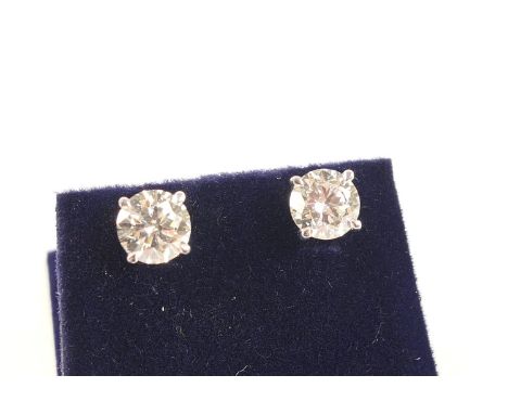 Good pair of diamond ear studs, each having a round brilliant cut stone of approx. 1.45cts, estimated as J/K in colour and SI