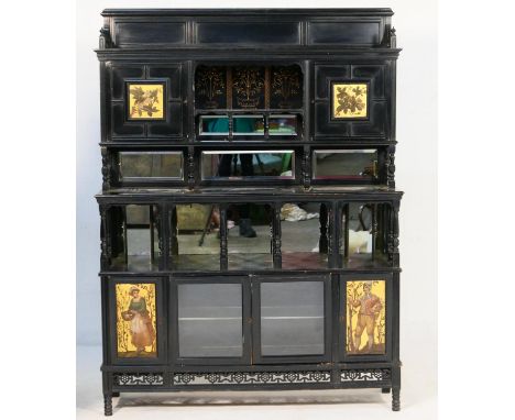 Aesthetic period ebonised salon cabinet, circa 1885, the upper part having two painted panel cupboard doors, flanking a mirro