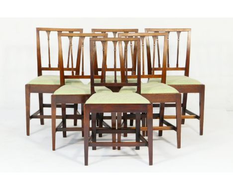 Set of six Regency mahogany dining chairs, circa 1810-20, each with stiff leaf carved stick backs, upholstered drop-in seat r