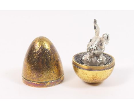 Stuart Devlin silver gilt surprise egg, London 1973, numbered 183, gilt textured exterior opening to reveal a rabbit,  7cm, w