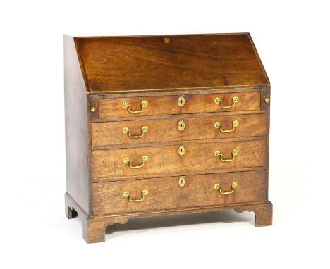George III mahogany bureau, circa 1770, having a simple interior with pigeonholes, four long graduating drawers with substant
