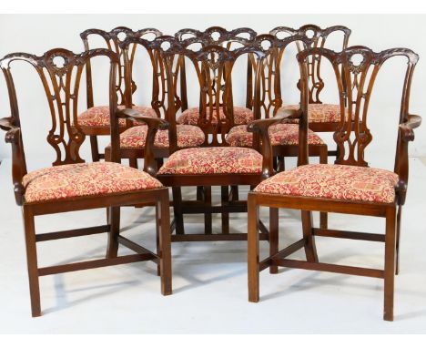 Set of eight mahogany dining chairs in the Chippendale style, comprising two carvers and six singles, each with a carved top 
