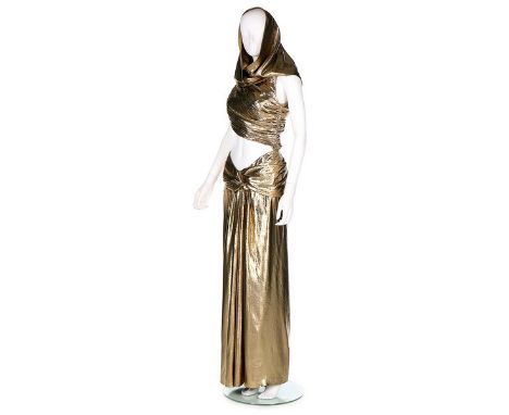 An Yves Saint Laurent sari-style gold lamé gown, Autumn-Winter 1991-2, Rive Gauche labelled and size 40, the cropped asymmetr