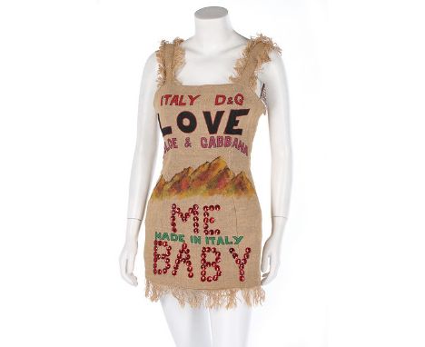 A Dolce &amp; Gabbana jute 'feedsack' mini-dress, Spring-Summer 1992, labelled and size 42, the front painted with slogans an