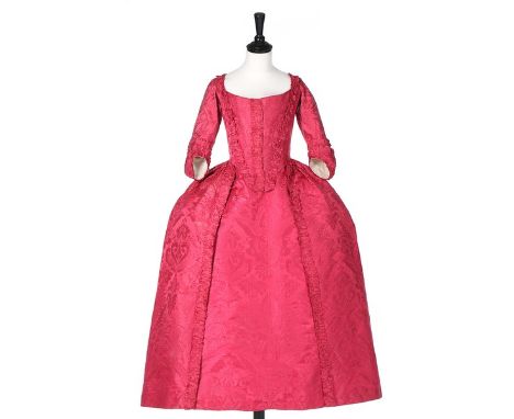 A crimson damask silk robe à l'Anglaise, circa 1770, the fabric late 1720s, early 1730s, the closed front bodice, front skirt