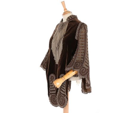 A beaded brown velvet 'visite', 1880s, the butterfly-like 'sleeves' formed entirely from braided and woven silk cord and gold