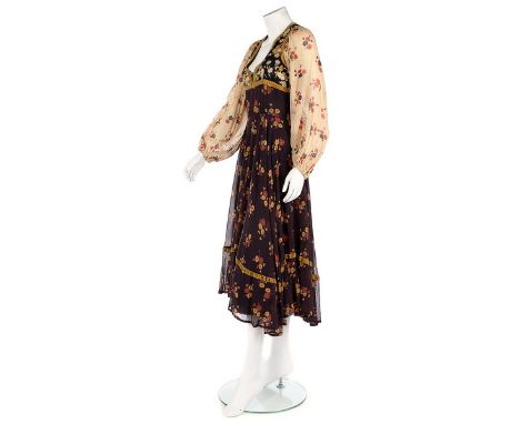 A Thea Porter floral printed voile 'gypsy' dress, 1969, woven black on white label, the bodice with plunging neckline and tri