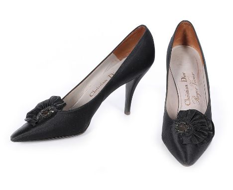 A pair of Christian Dior by Roger Vivier 'Soraya' black satin evening shoes, 1962-63, with triple flounced cockades and black