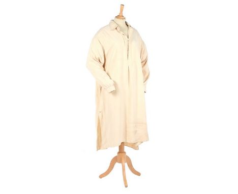 Winston Churchill's cream silk night-shirt, 1932, embroidered in red cross stitch 'WLSC 32', of soft, heavy twill silk, with 