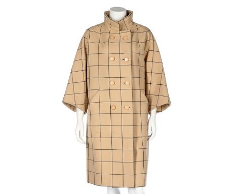 A fine Balenciaga couture checked wool coat, Spring-Summer, 1966, Paris labelled and numbered 95470, the broad navy window-pa