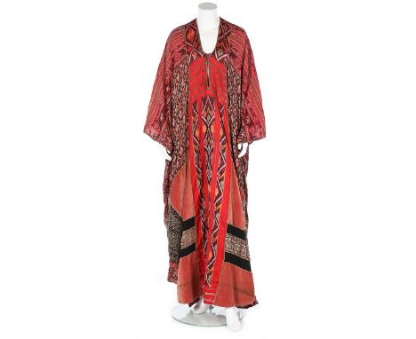 A Thea Porter abaya/kaftan dress, mid 1970s, couture labelled, of ikat silk, the hem inset with a patchwork of pink velvet, l
