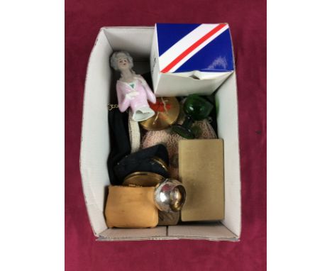 A box containing a half pin doll; a silver serviette ring; lady's evening purses; compacts etc.