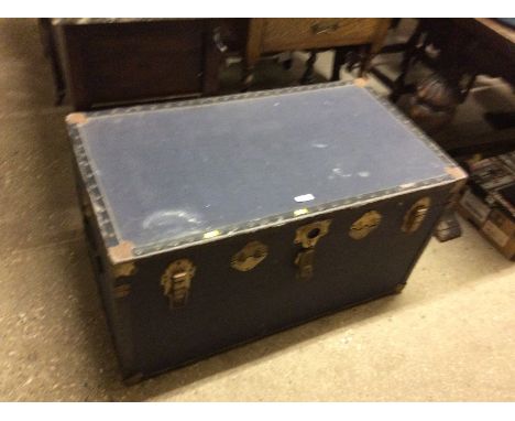 A metal bound travelling trunk 
