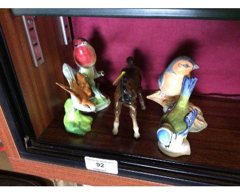 Four various bird ornaments to include a Goebel blue tit mouse; a Coalport example etc. together with a Beswick horse