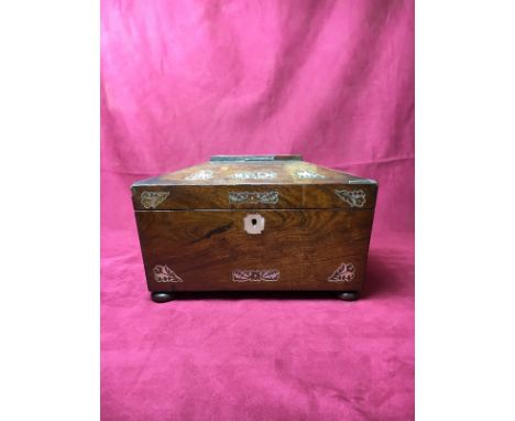 A Victorian rosewood and mother of pearl inlaid tea caddy