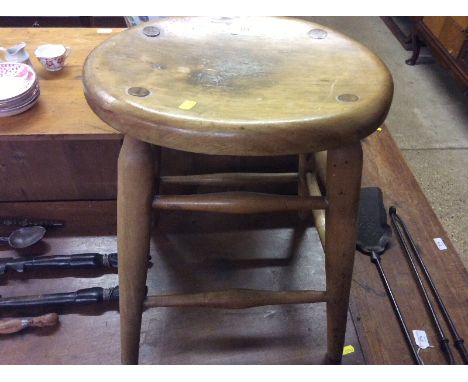 A beech oval top stool