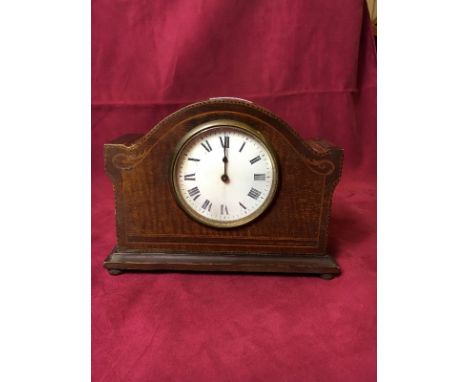 An Edwardian mahogany and inlaid mantel clock