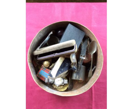 A tin containing a Rotary wrist watch; various badges; a pipe; a collection of North Hamptonshire Regiment buttons