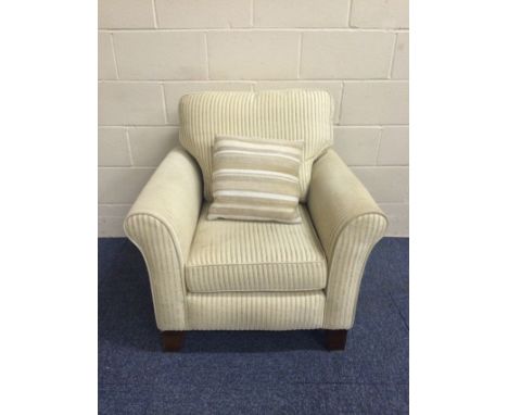 20th C armchair in good quality cream self-stripe fabric and a contrast cushion. Castors.See our Important Sale Information p
