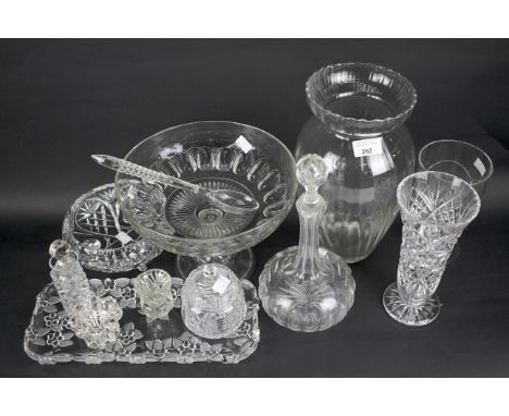 An assortment of glassware. Including a decanter, tray and vases, some with moulded and cut decoration